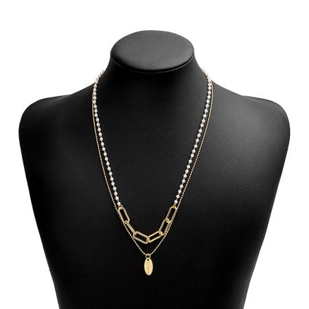 Close-up of the White Pearl Strand Necklace on a black display bust, highlighting its layered design.
