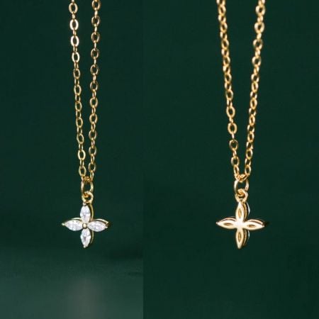 Two variations of the gold clover pendant necklace.