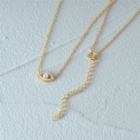 Close-up of the necklace clasp and extender chain for adjustable length.