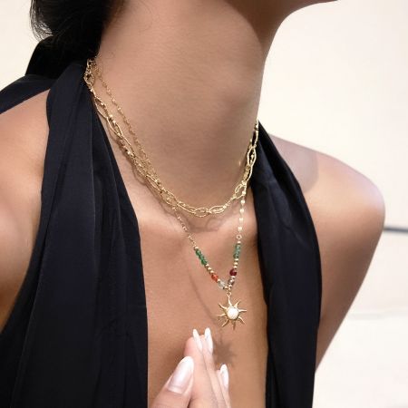 Close-up of the colorful beaded sun pendant necklace highlighting the non-tarnish stainless steel and PVD gold plating.