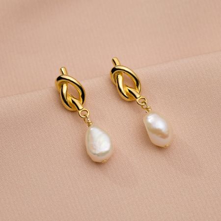 Another angle of the gold-plated pearl drop earrings.