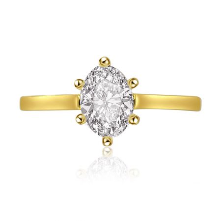 Oval Cut Solitaire Ring with Grooved Band - Elegant oval cut solitaire ring with a grooved gold band, featuring a sparkling white cubic zirconia stone.