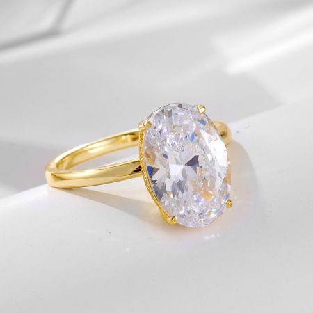 A beautiful gold-plated S925 silver ring featuring a large oval diamond-like cubic zirconia.