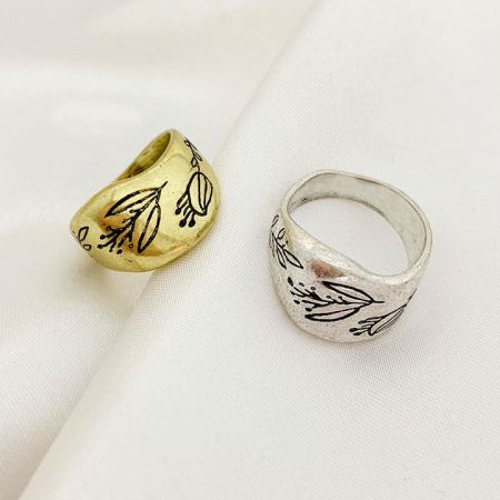 Side-by-side view of the gold and silver floral engraved brass rings.
