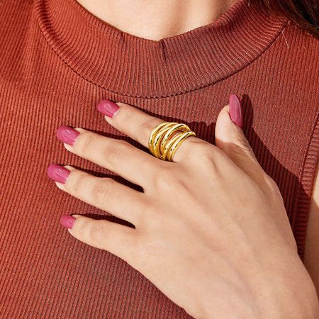 Close-up of the gold vintage multi-layered cuff open ring being worn.