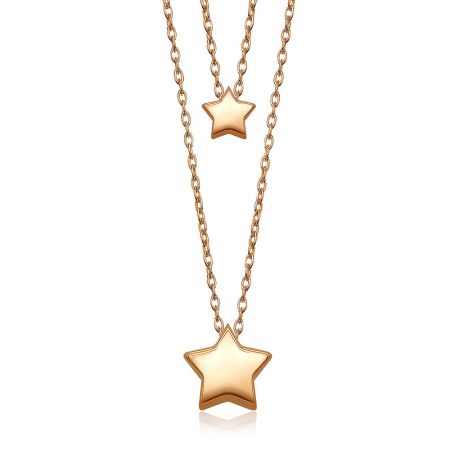 A model wearing the Twin Star Necklace, demonstrating its layering potential and elegant look.