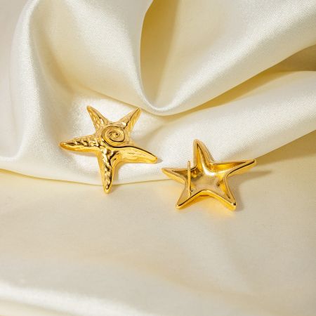 A pair of 18K gold plated star stud earrings displayed on a neutral background.