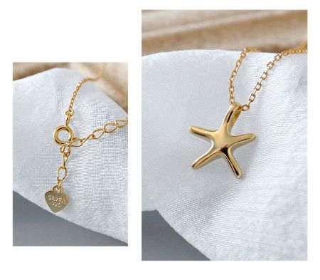 The gold starfish necklace featuring a heart-shaped charm stamped with 'SILVER 925'.