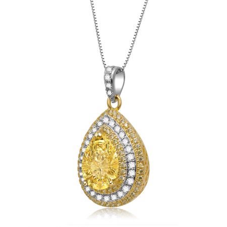 Side view of the two-tone teardrop pendant with a brilliant yellow gemstone.