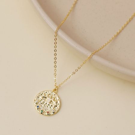 Another view of the gold-tone evil eye necklace showcasing the multicolor gemstone details.