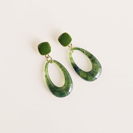 Side angle of the green marbled stone earrings, showing the texture and gold link details.