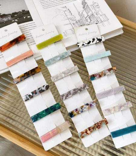 Wholesale Acetate Resin Hair Clips - A vibrant collection of wholesale acetate resin hair clips in various colors and patterns, offered by JR Fashion Accessories.