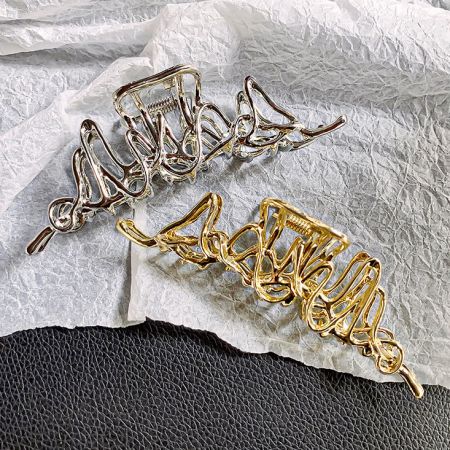Side-by-side comparison of the silver and gold geometric hair clips.