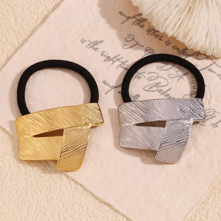 Girls Waterproof Stainless Steel Geometric Style Band Elastic Rope for Hair - A pair of stainless steel geometric hair ties, one in a polished gold finish and the other in a sleek silver finish, displayed on a clean white background.