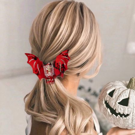 A model wearing the red bat wing hairpin, showcasing its gothic style for Halloween.