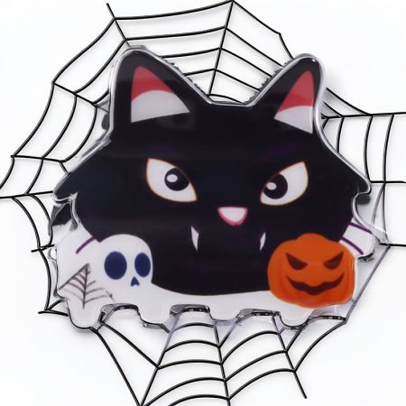 Black cat themed Halloween hair clip with spider web and skull details.