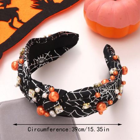 Detailed view of a black spiderweb headband embellished with sparkling beads.