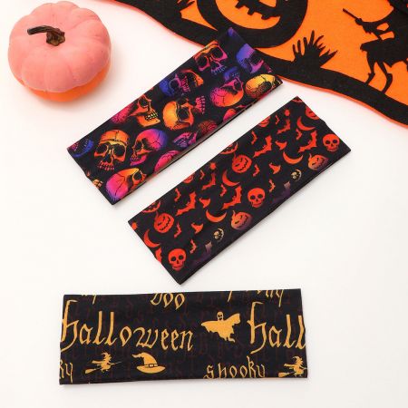 A black headband featuring a repeating white skull pattern for Halloween.