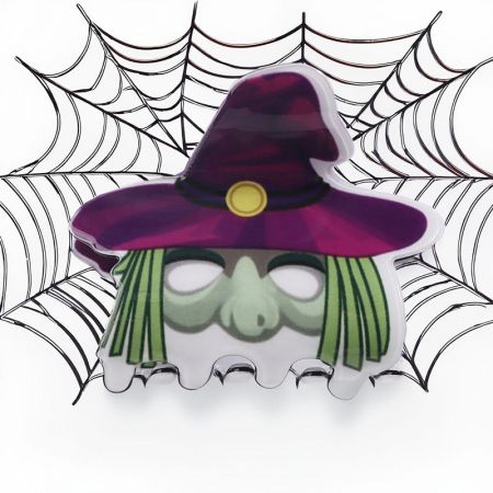 Detailed view of a witch-themed Halloween hair claw clip.