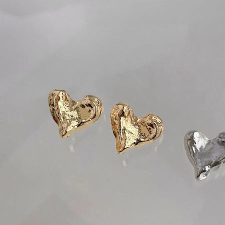 14K Gold Plated Brass Heart Stud Earrings - A collection of 14K gold plated and silver brass heart stud earrings with an irregular, artistic design, displayed for wholesale.