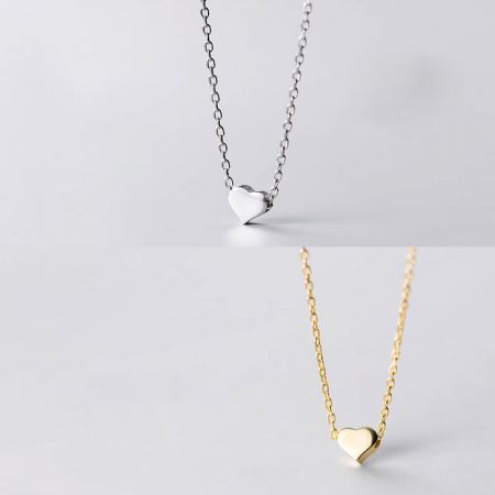 Elegant presentation of the silver and gold heart pendant necklaces.
