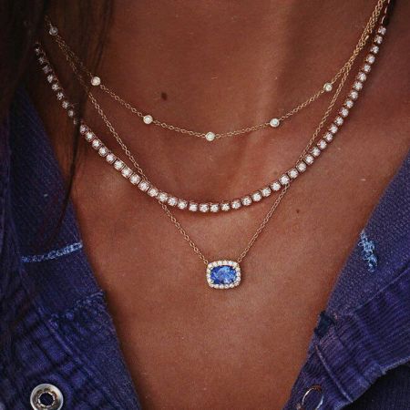 Full view of the layered necklace set, highlighting the different pendant styles.