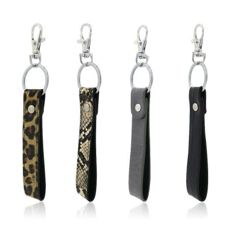 Vários designs de chaveiros de couro PU com diferentes padrões.