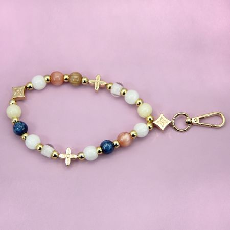 Beaded Phone Charm & Bracelet Strap - Bulk Wholesale - A vibrant multicolor beaded phone charm and bracelet strap made from acrylic, featuring gold-tone accents and a secure clasp, available for bulk wholesale.