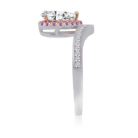 Side profile of the two-tone engagement-style ring, displaying the intricate rose gold setting and band details.