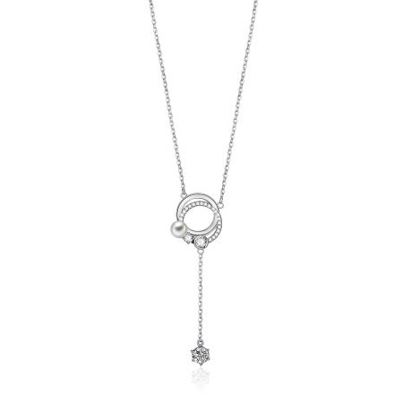 Double Ring Drop CZ Pendant - A close-up of the Double Ring Drop CZ Pendant, showcasing its interlocking rings paved with cubic zirconia and a central white pearl.