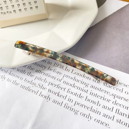Close-up of a hair clip with a beautiful marbled acetate pattern.