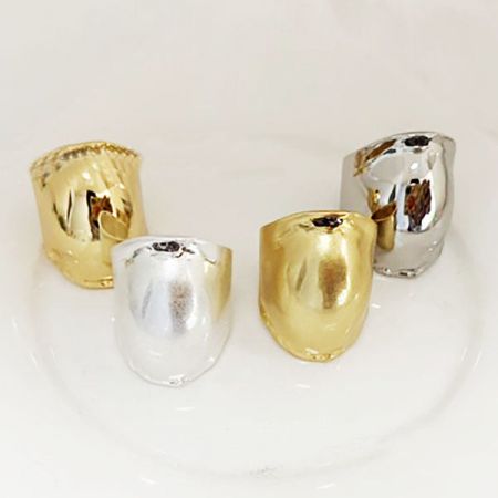 Brass Vintage Large Polished Drum-Shaped Curved Rings - A set of brass vintage drum-shaped curved rings in polished gold and silver finishes.
