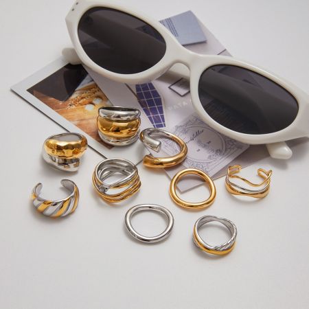 Lifestyle shot of the metallic dual-tone ring set, shown with sunglasses to highlight its summer fashion appeal.