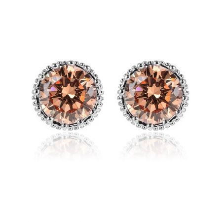 Solitaire Stud Crown Earrings in Rhodium Wholesale - A pair of Solitaire Stud Crown Earrings in rhodium plating, featuring peach-colored, faceted cubic zirconia gemstones in a detailed silver crown setting.