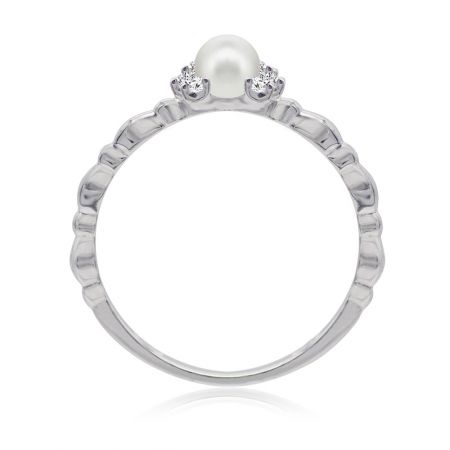 Detailed view of the Pearl CZ Fine Band Ring on a reflective surface, emphasizing the sparkle of the cubic zirconia.