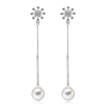 CZ Simulated Pearl Dangle Earrings - A close-up view of the CZ Simulated Pearl Dangle Earrings, showcasing the intricate silver and crystal details above the lustrous pearl.