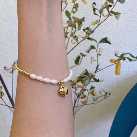 Alternative style featuring a bell charm instead of a heart.