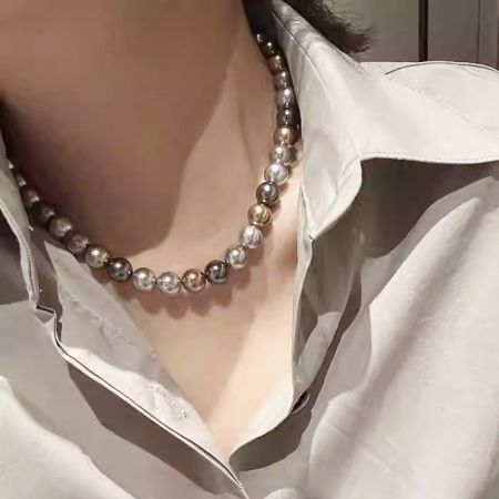Model wearing the elegant Morandi-colored pearl necklace to showcase its length and style.