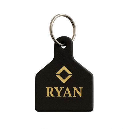 A personalized leather keychain with the name 'RYAN' engraved, perfect for unique corporate or personal gifts.
