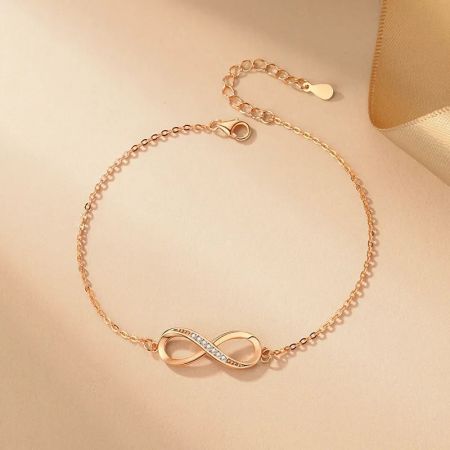 A beautiful rose gold version of the infinity charm bracelet, adorned with cubic zirconia.