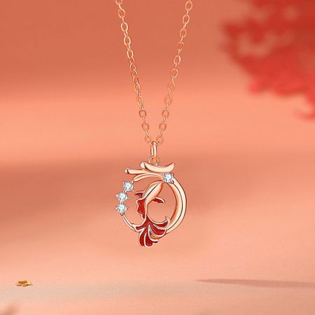 A decorative rose gold necklace with a gemstone pendant, showcasing the craftsmanship of JR Fashion Accessories.