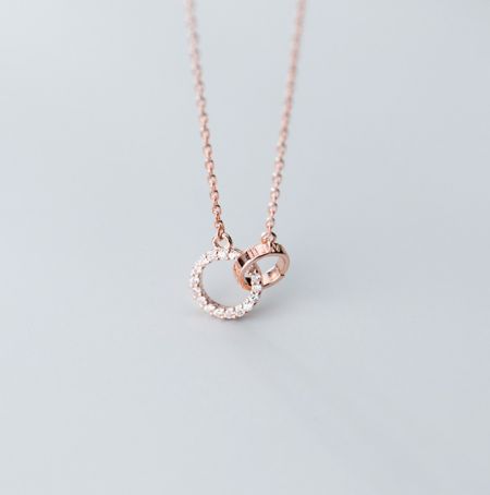 Rose gold version of the interlink circle necklace with cubic zirconia.