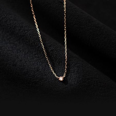 Detailed view of the rose gold finish on the sterling silver CZ necklace.