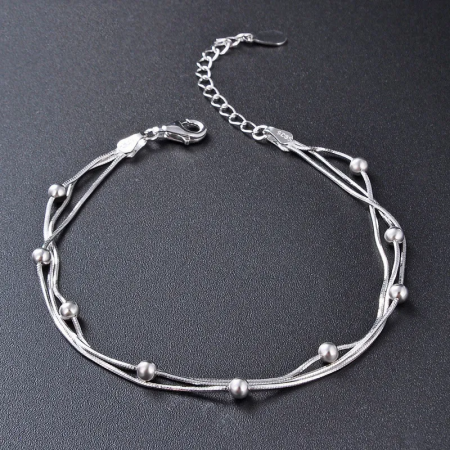 The 925 sterling silver stamp is visible on the bracelet's clasp, ensuring authenticity.