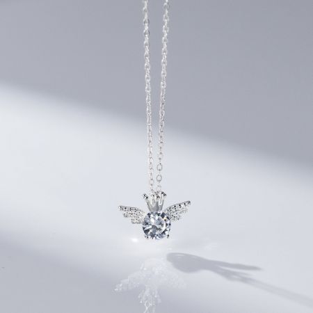 925 Sterling Silver Crown-Wing Pendant Necklace - A detailed view of a 925 sterling silver crown-wing pendant necklace, showcasing its intricate angel wing design and sparkling clear gemstone.