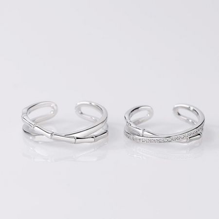 Two variations of the sterling silver bamboo cuff rings, showcasing the detailed texture.