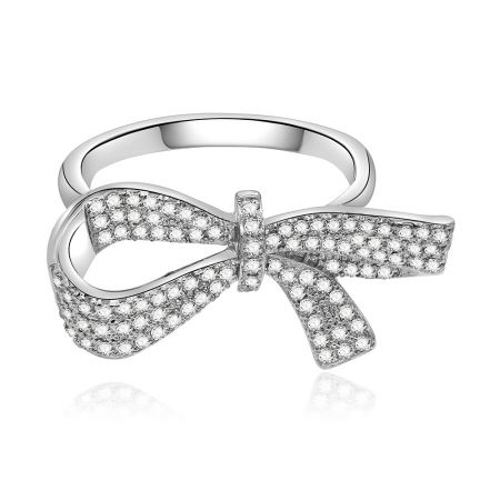Large Charming Bow Ring - Front view of the Large Charming Bow Ring, showcasing its intricate bow design crafted from rhodium-plated brass and pave-set with sparkling cubic zirconia stones.