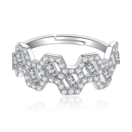 Detailed view of the zircon studded brass ring, highlighting the interconnected links and clear gemstones.