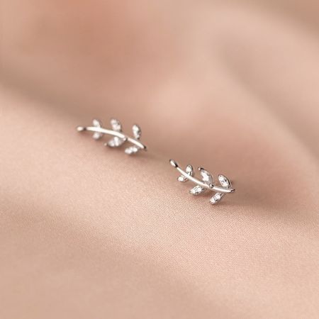Detailed view of the sterling silver olive leaf stud earrings showcasing the intricate branch design and CZ stones.