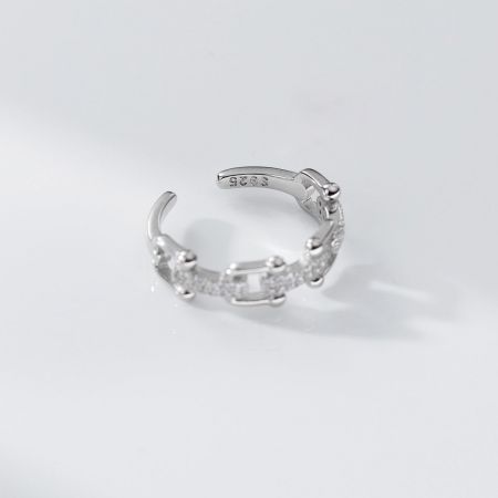 A complete view of one of the adjustable U-link rings, showcasing its polished silver finish.